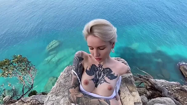 Inked chick with short hair swallows sperm after insane blowjob on the beach