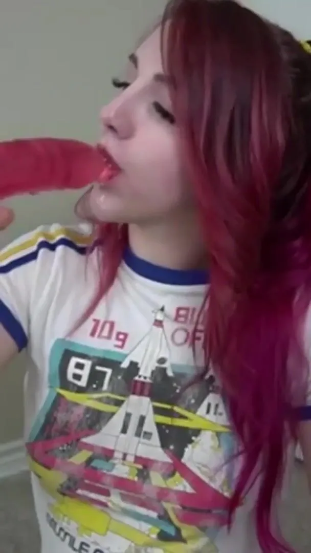 Girl choking on huge dildo.