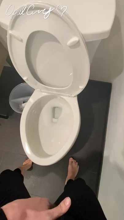 Standing pee into the toilet