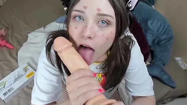 Attractive teen spreads her ass-cheeks and gags dildo in solo scene