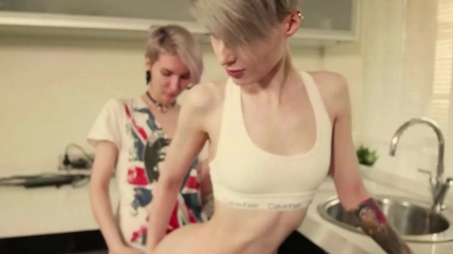 Classic short-haired skinny lesbians makes use of a strapon in the kitchen hq nude pic