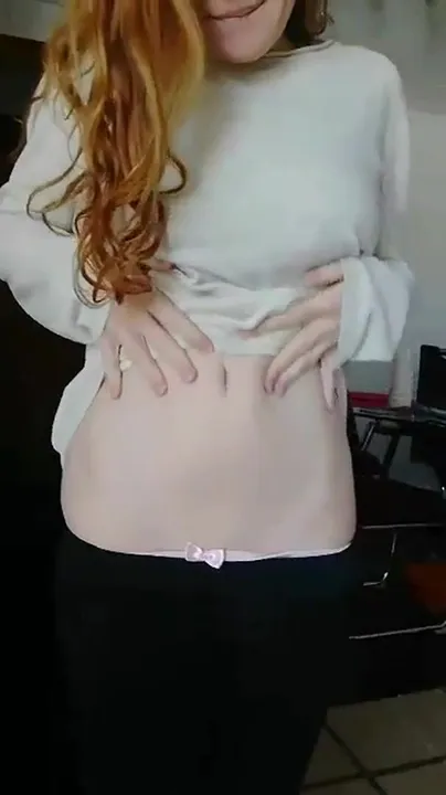 She's a redhead, she's small, and she has surprise tits!