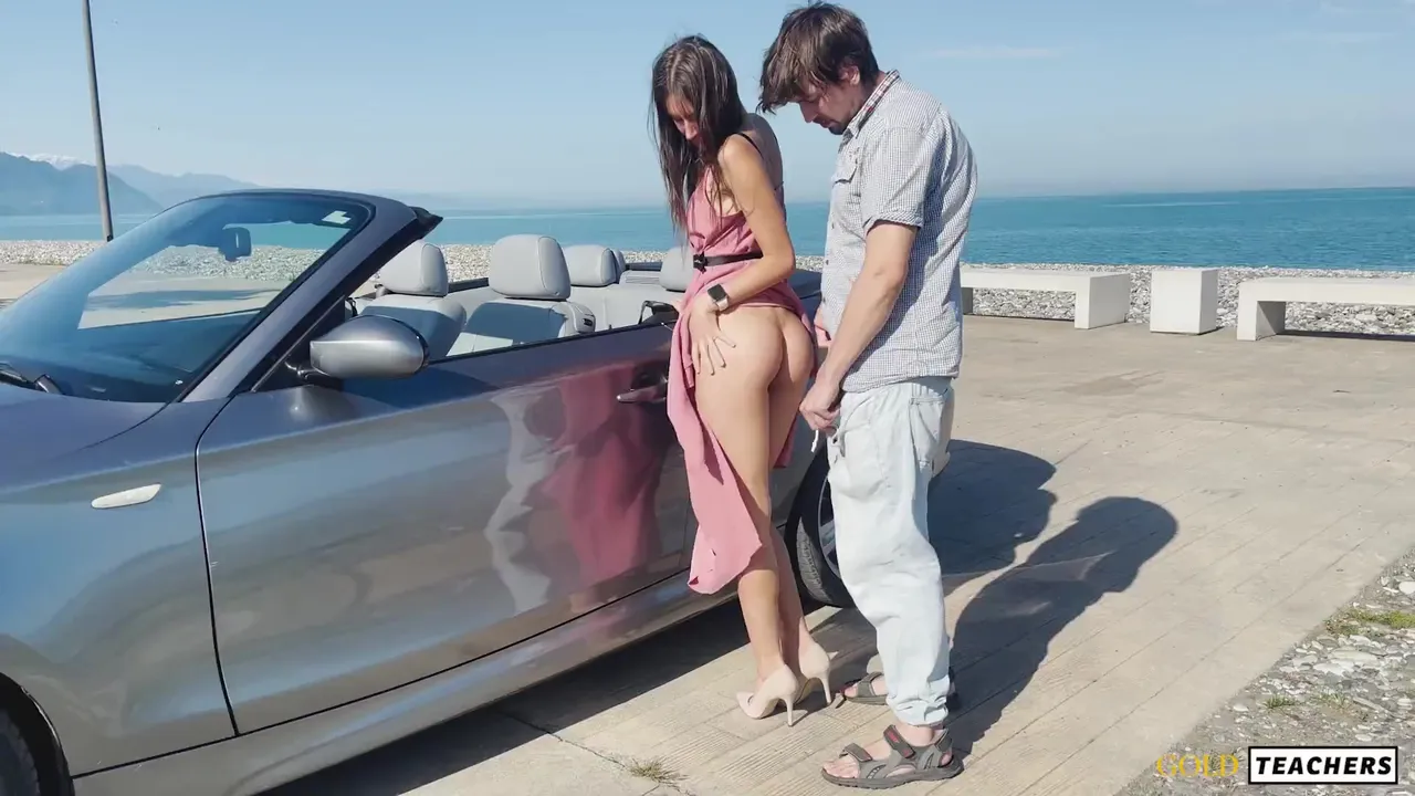 Slim babe lets rich guy fuck her on ocean shore next to his bimmer image