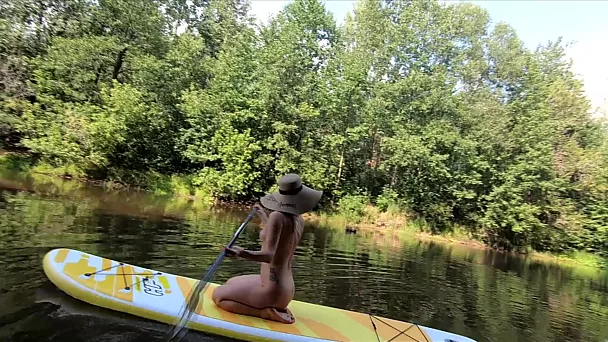 Russian blonde nudist went on a trip on her inflatable boat completely naked