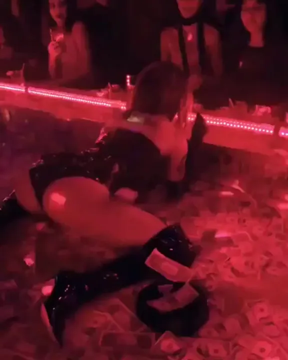 Halsey performing at a strip club