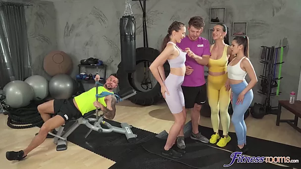 Three Sexy Busty Sporty Cuties Tempt Two Guys To a Gonzo Orgy In the Gim