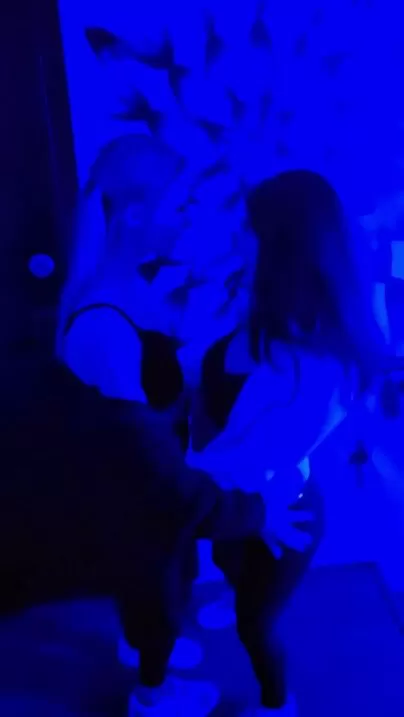 Friends make out while clubbing