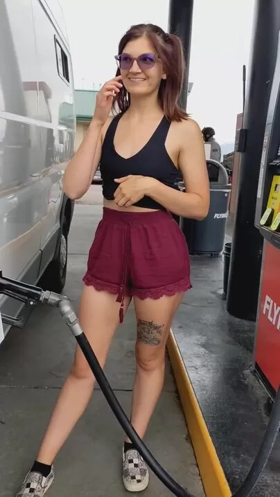 Don't mind me filling up gas with my tits out