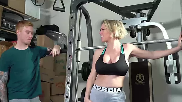 Busty cougar works out in gym using her trainer's cock