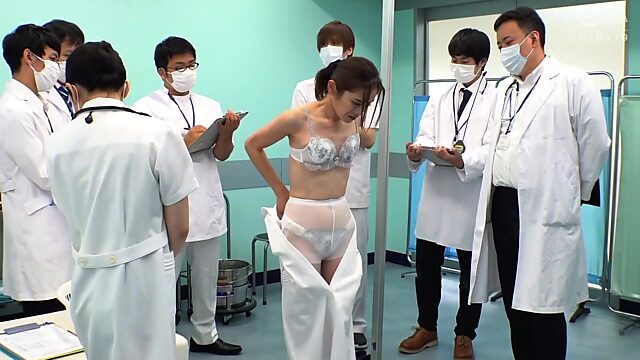 Slim Japanese Milf undresses in front of the doctors