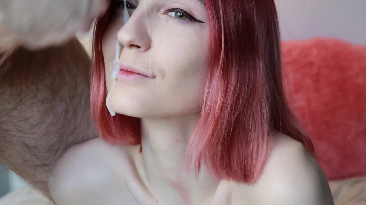 Redhead enjoys hot sperm on her face pic