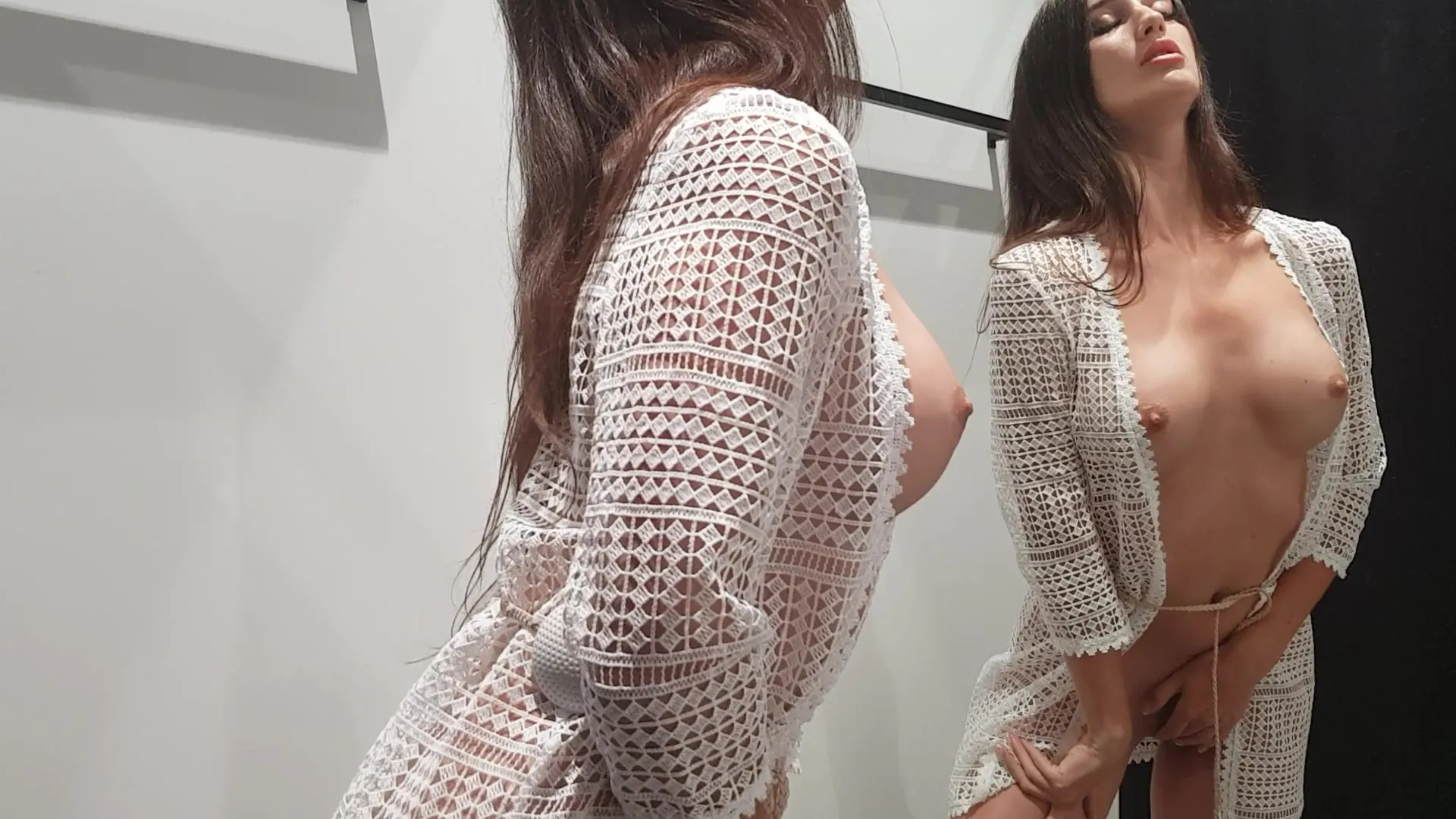 Gorgeous Busty Brunette Masturbates in Fitting Room photo