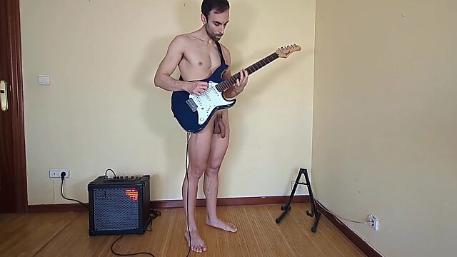 Gay dude exposes his dick and balls while playing the guitar