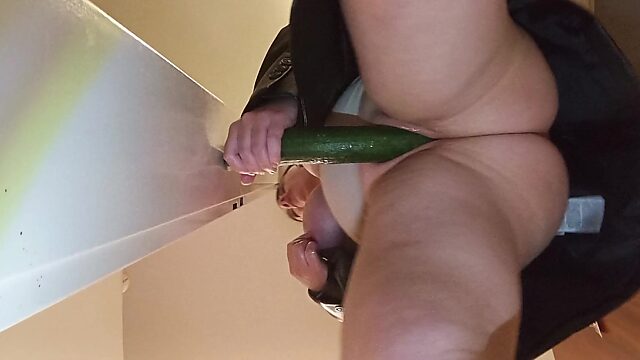 Thick chick masturbating with a cucumber solo