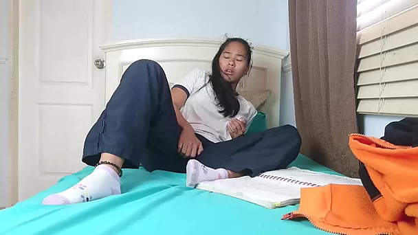 Thai schoolgirl takes a break for the sensual masturbation of her pussy.