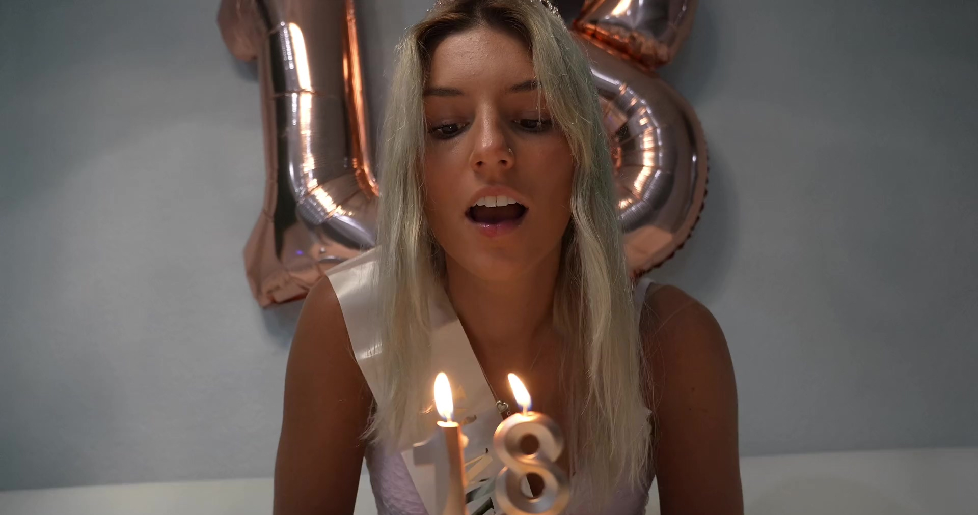 A young slut with small tits got a dose of cum on her face for her birthday