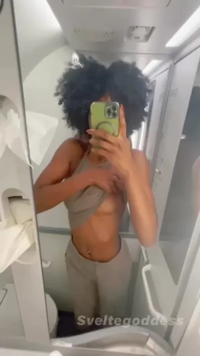 Silly gf filming herself on the plane's bathroom