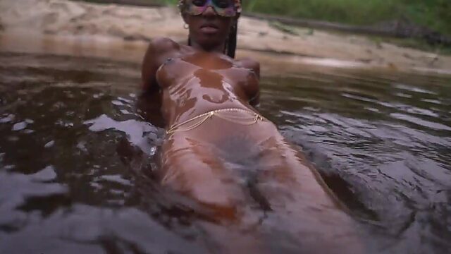 Slim Ebony Beauty With Perky Boobies Plays Naked In a Wild River At Sunset