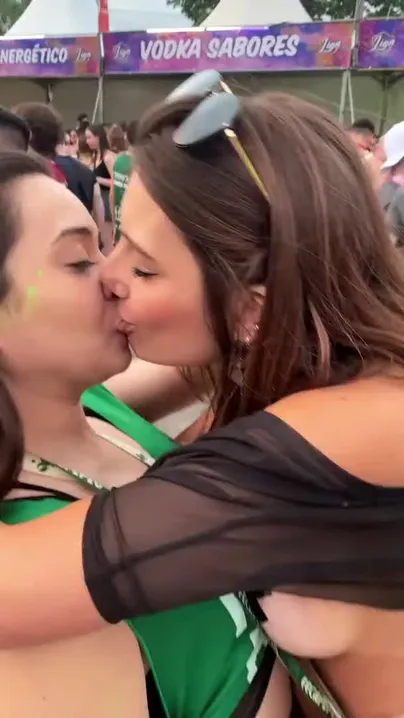 Brazilians kissing at party