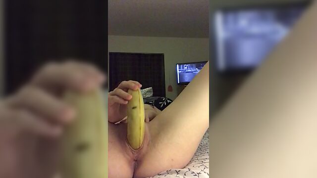 Nerdy bitch uses banana to satisfy herself. She puts it deep inside!