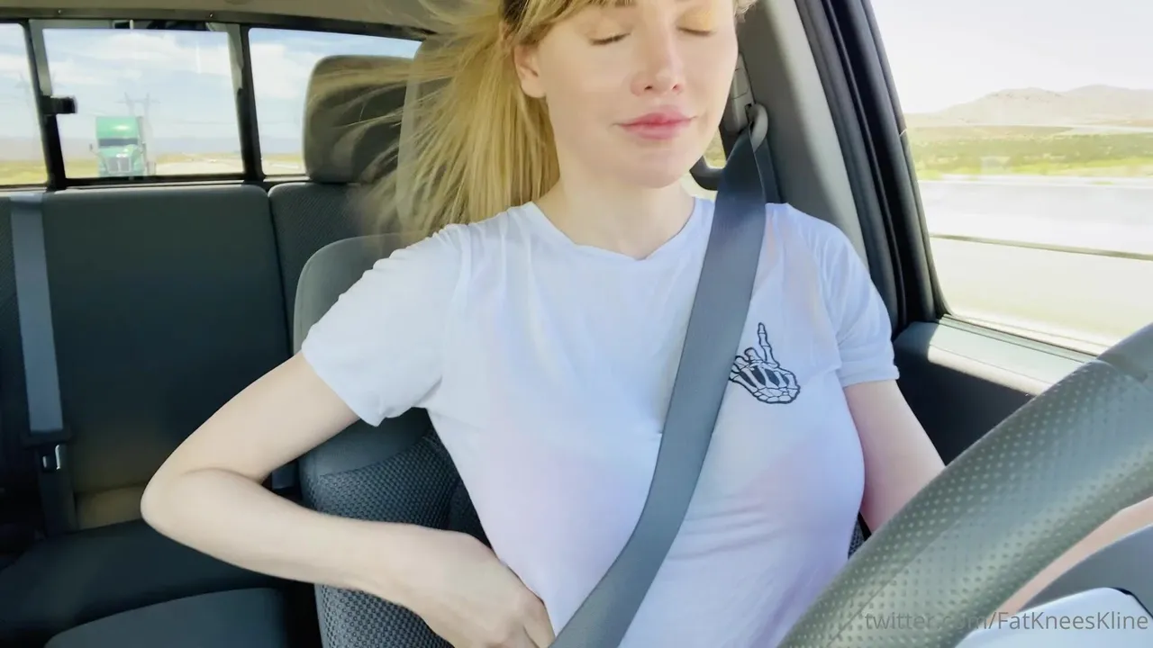 Taking bra off while driving at high speed without hands on steering wheel