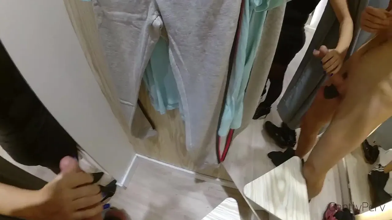 Handjob by a girl from outside a changing room, cum goes all over the floor