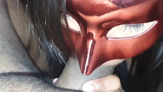 Latina in mask does blowjob and licks sperm from the table