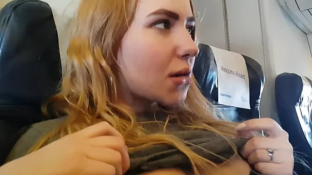 Handjob in the airplane with pretty blonde teen
