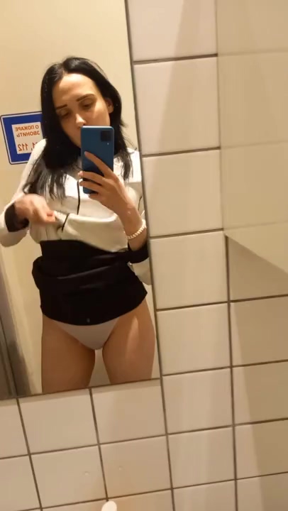 Brunette Amateur shoots Solo Video and rubs her pussy in Public Restroom