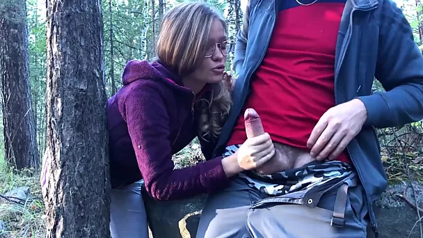 Nerdy chick blows cock and fucks in the woods